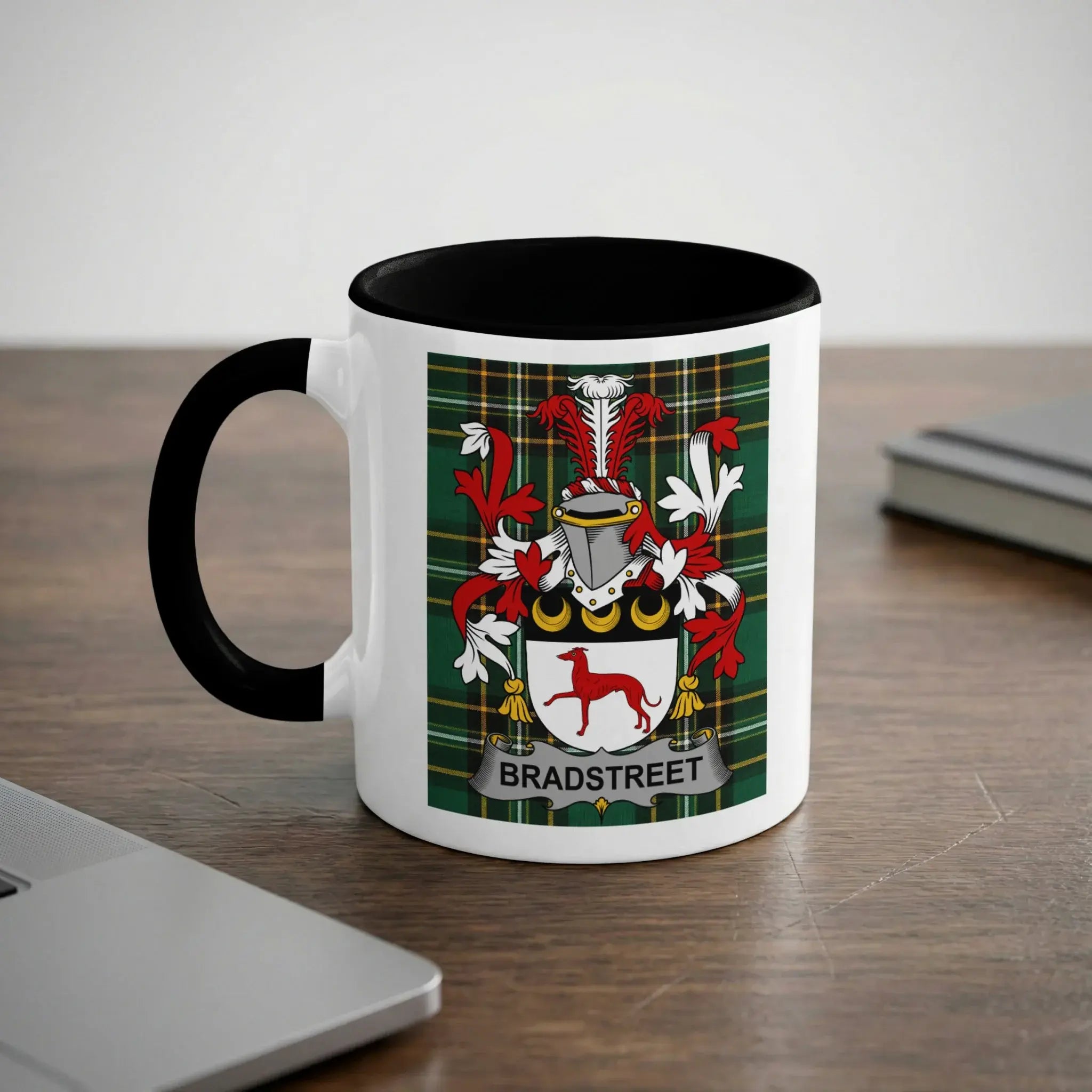 White mug with black rim featuring a Bradstreet family crest on a tartan background.