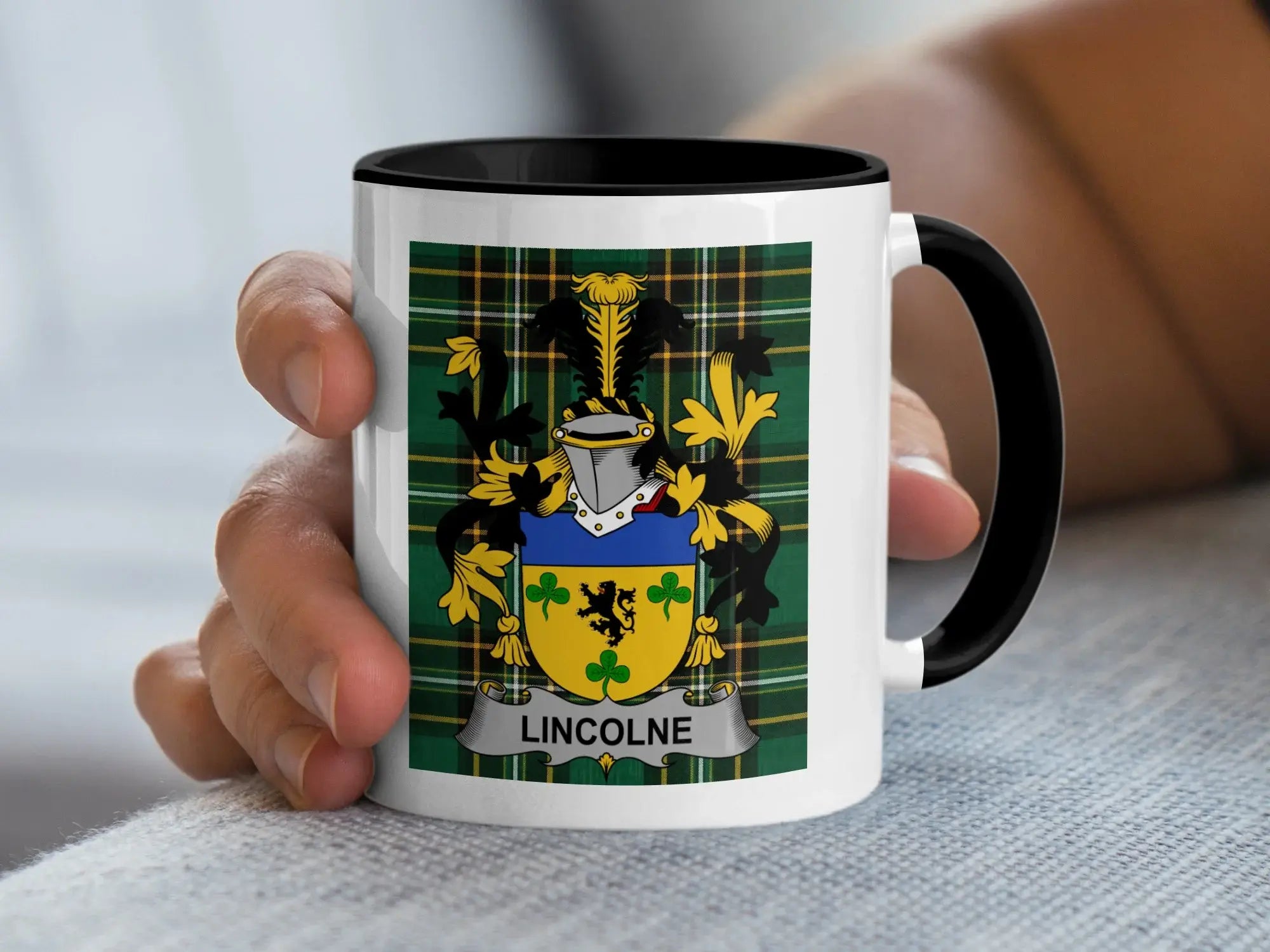 Mug with the Lincoln family crest on a tartan background.