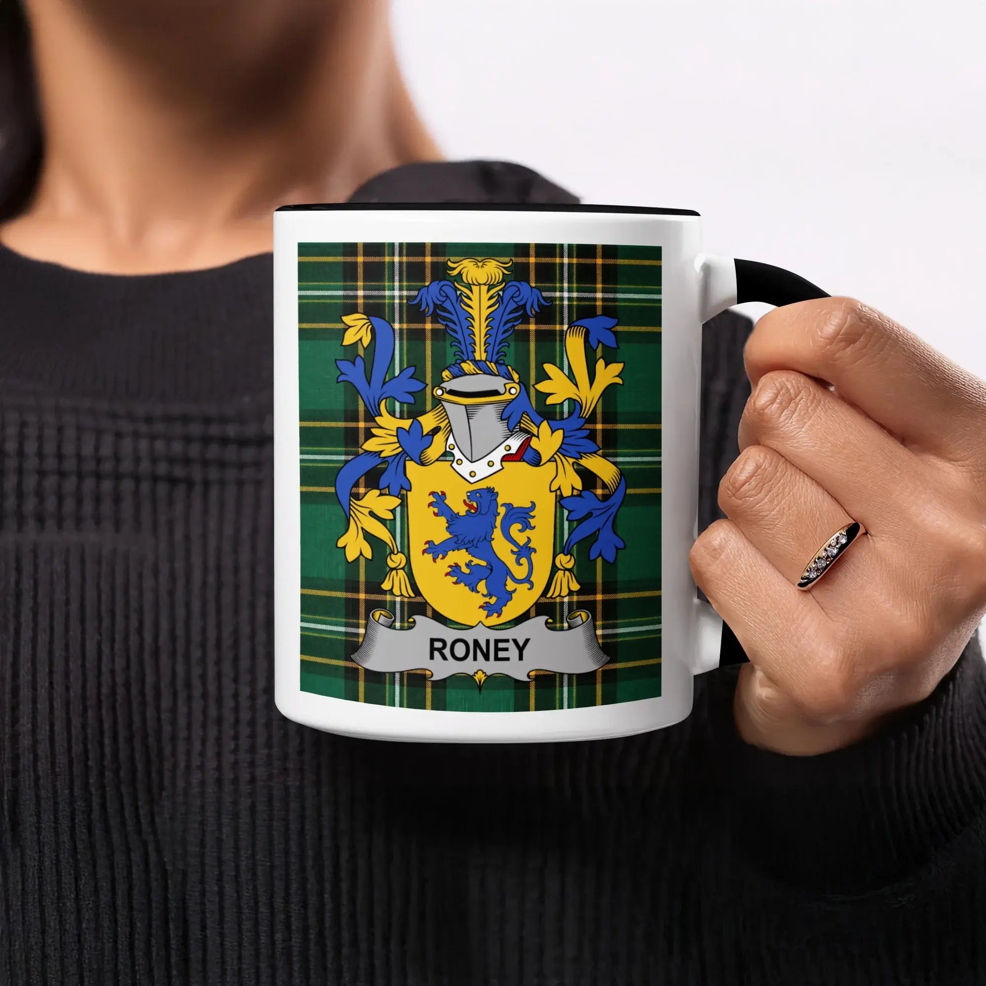Mug with Roney family crest on green tartan background.