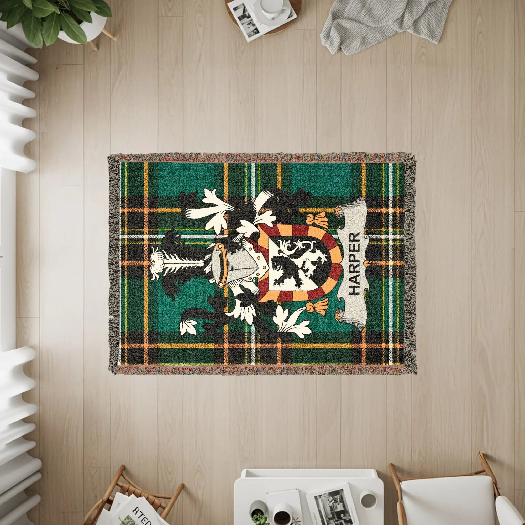 Green plaid woven throw blanket featuring the Harper family crest.