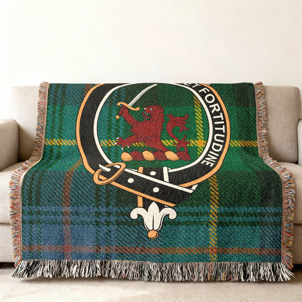 Farquharson woven blanket draped over sofa — 60x50 size, fringe edges and tartan detail