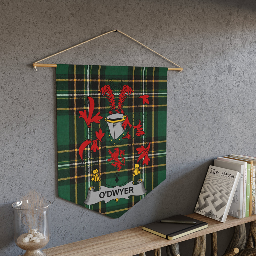 O'Dwyer tartan pennant with crest and a book titled "The Maze" on a shelf.