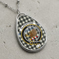 Gladstone clan Scottish tartan necklace with clan crest and Fide et Virtute motto on tartan background