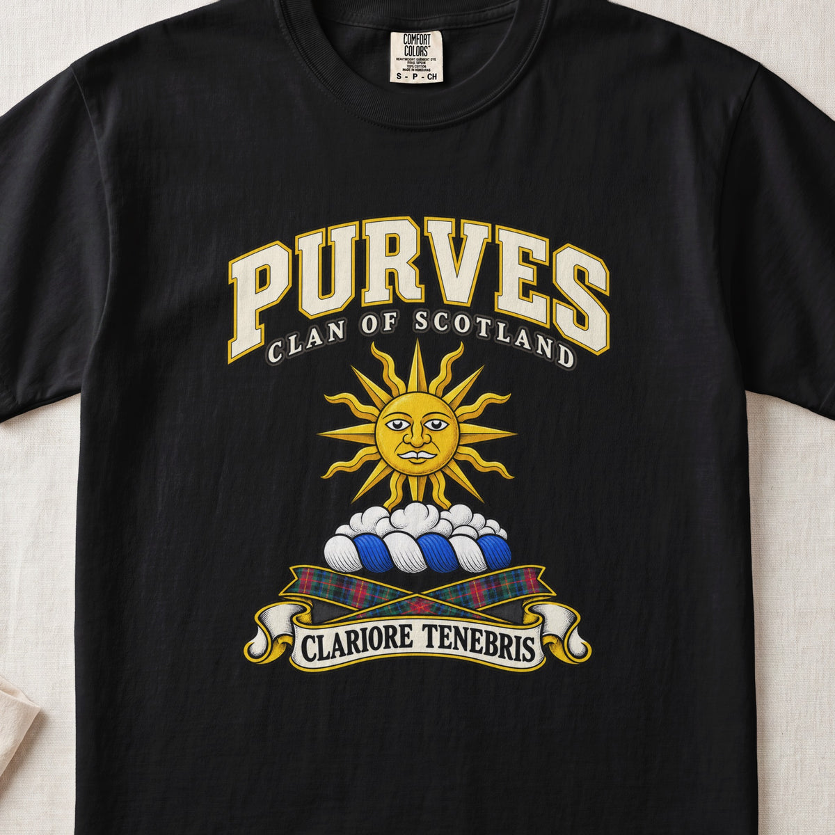 Purves Scottish clan T-shirt in Black, front view with a golden sun above clouds and motto design.