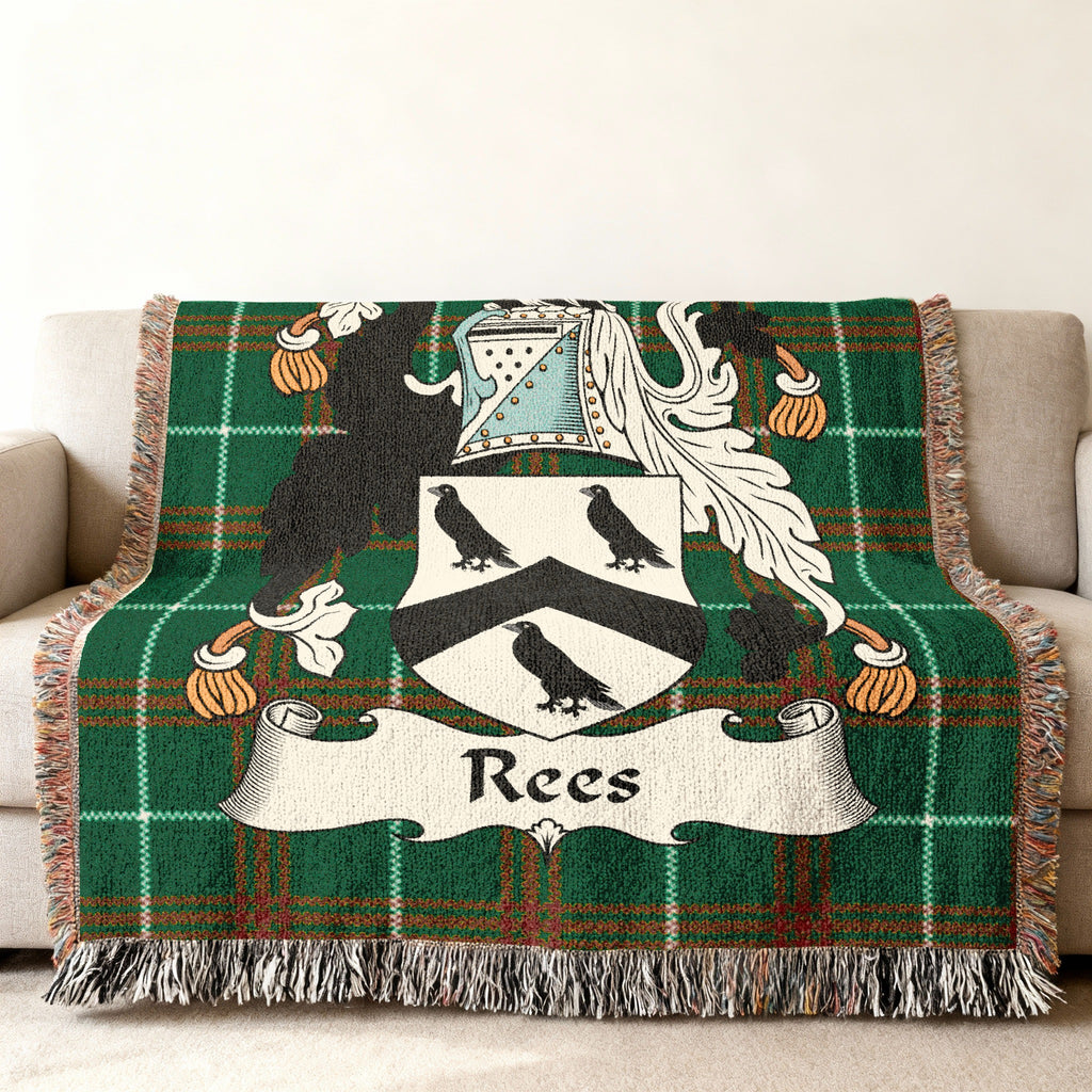 Green tartan throw blanket with the Rees family crest in the center.