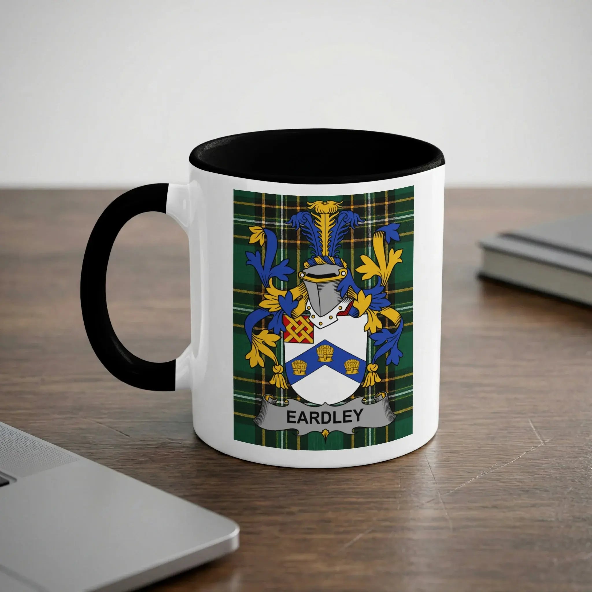 White mug with black handle featuring the Eardley family crest.