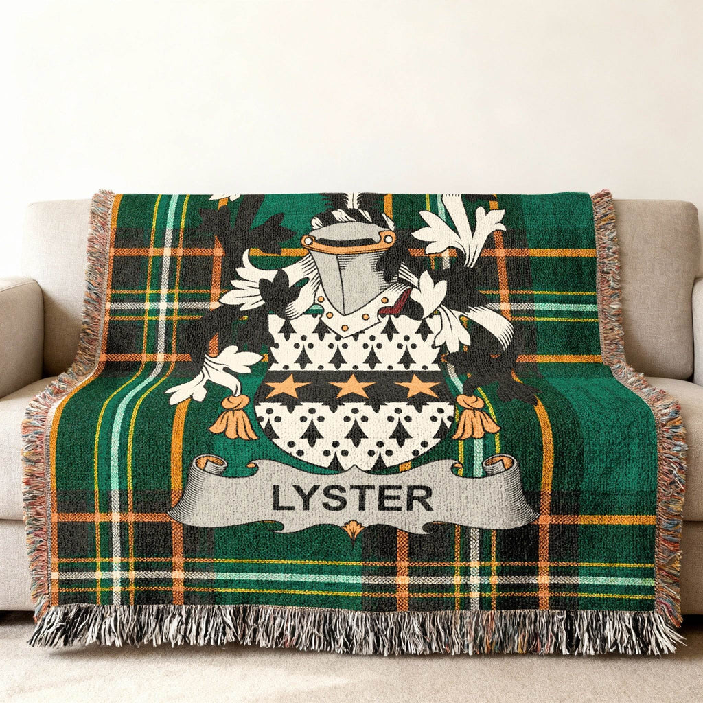 Green plaid throw blanket with coat of arms and "LYSTER" name.