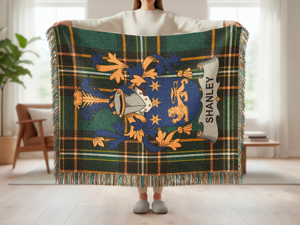 Tartan blanket with Shanley family crest displayed.
