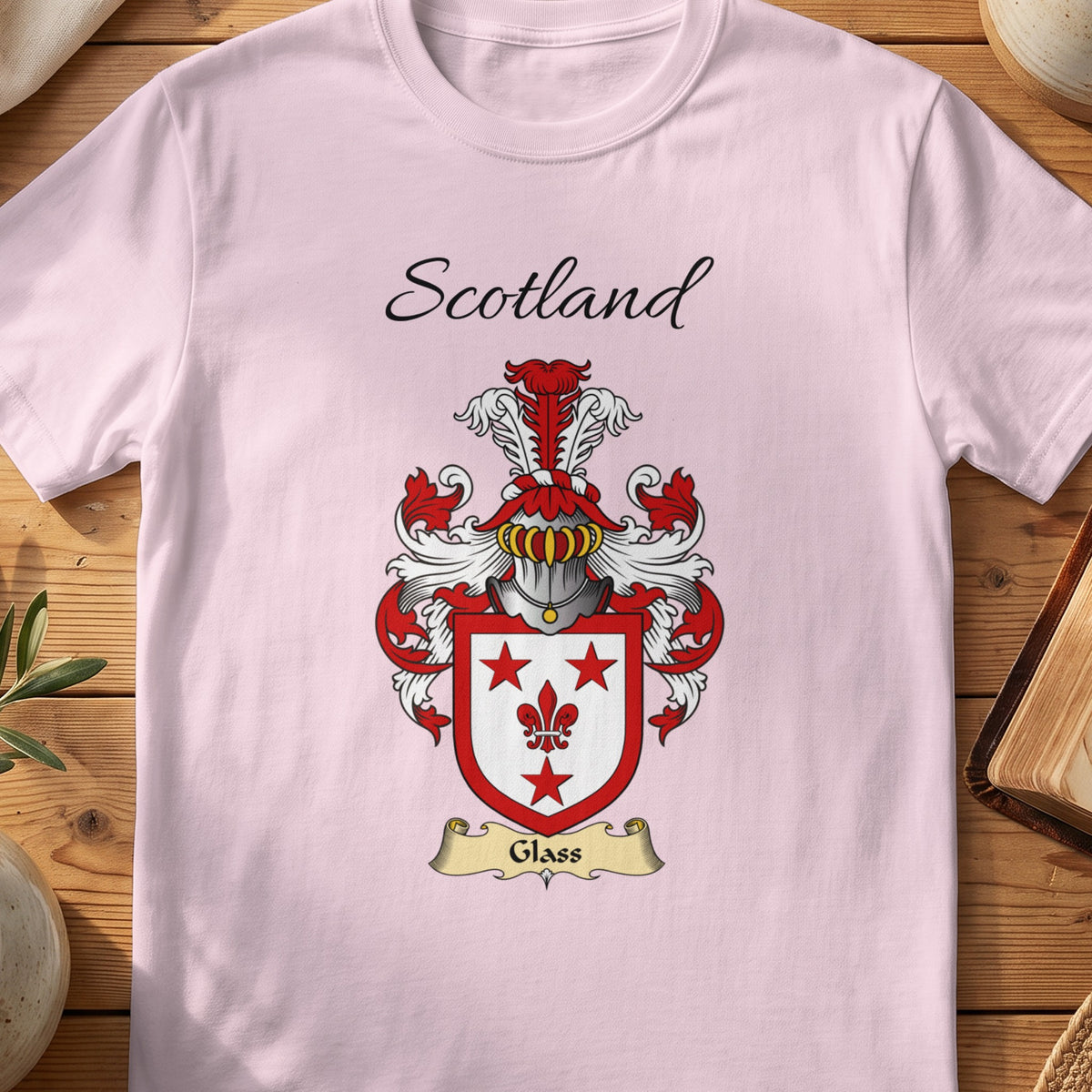 Light Pink Glass Scottish family shield T-shirt featuring red stars and a fleur-de-lis on white