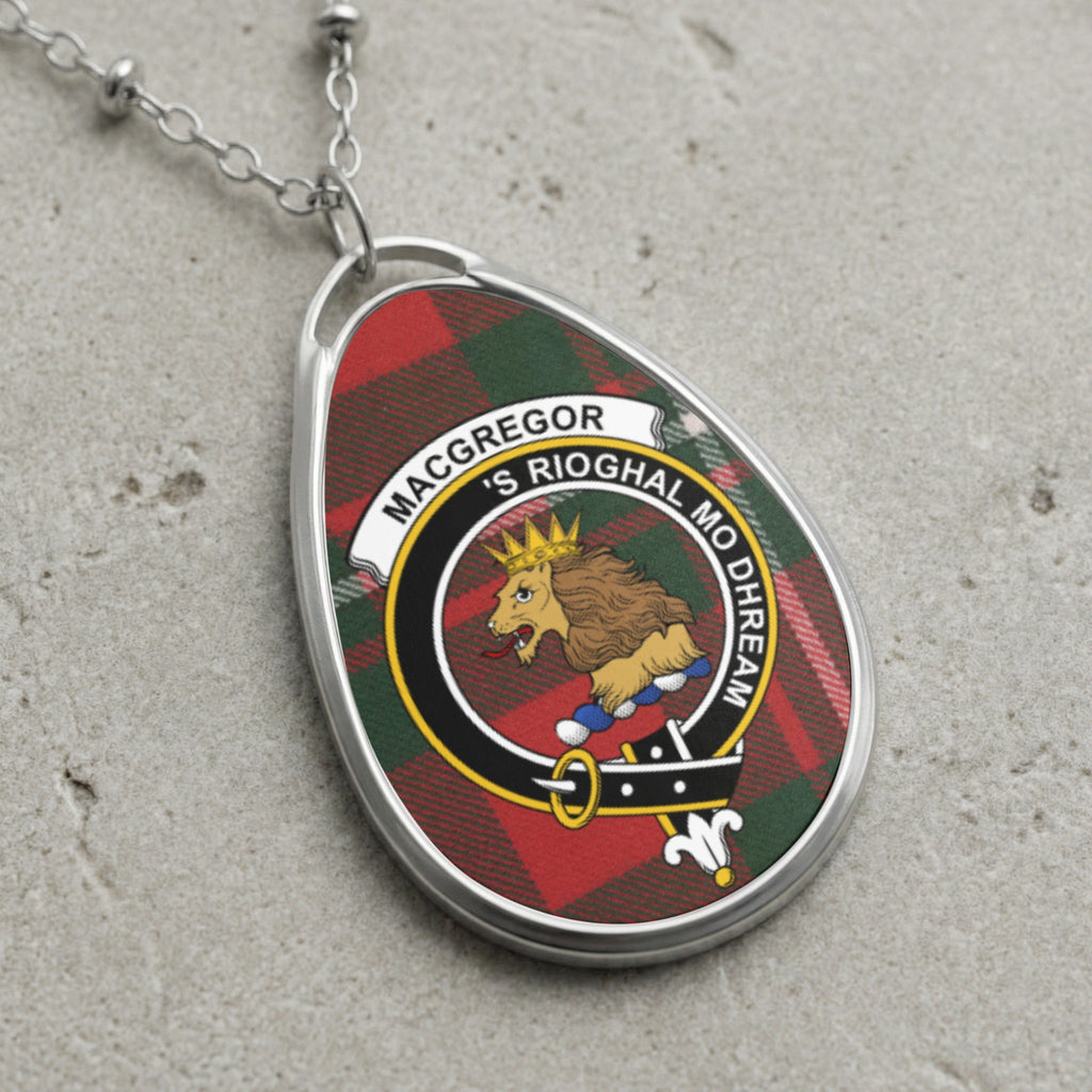 MacGregor clan crest pendant with tartan background and motto.