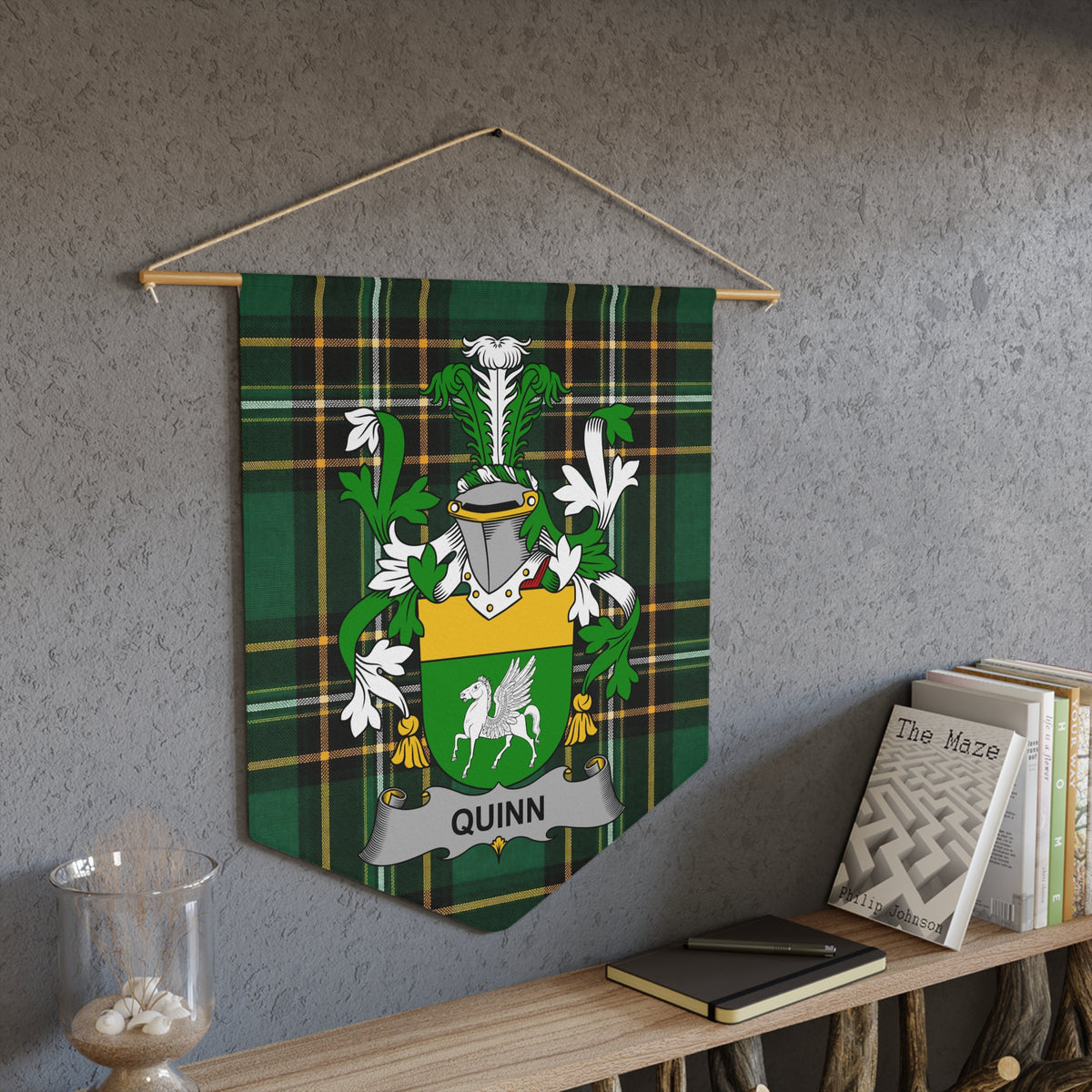 Quinn family crest banner with green plaid background.