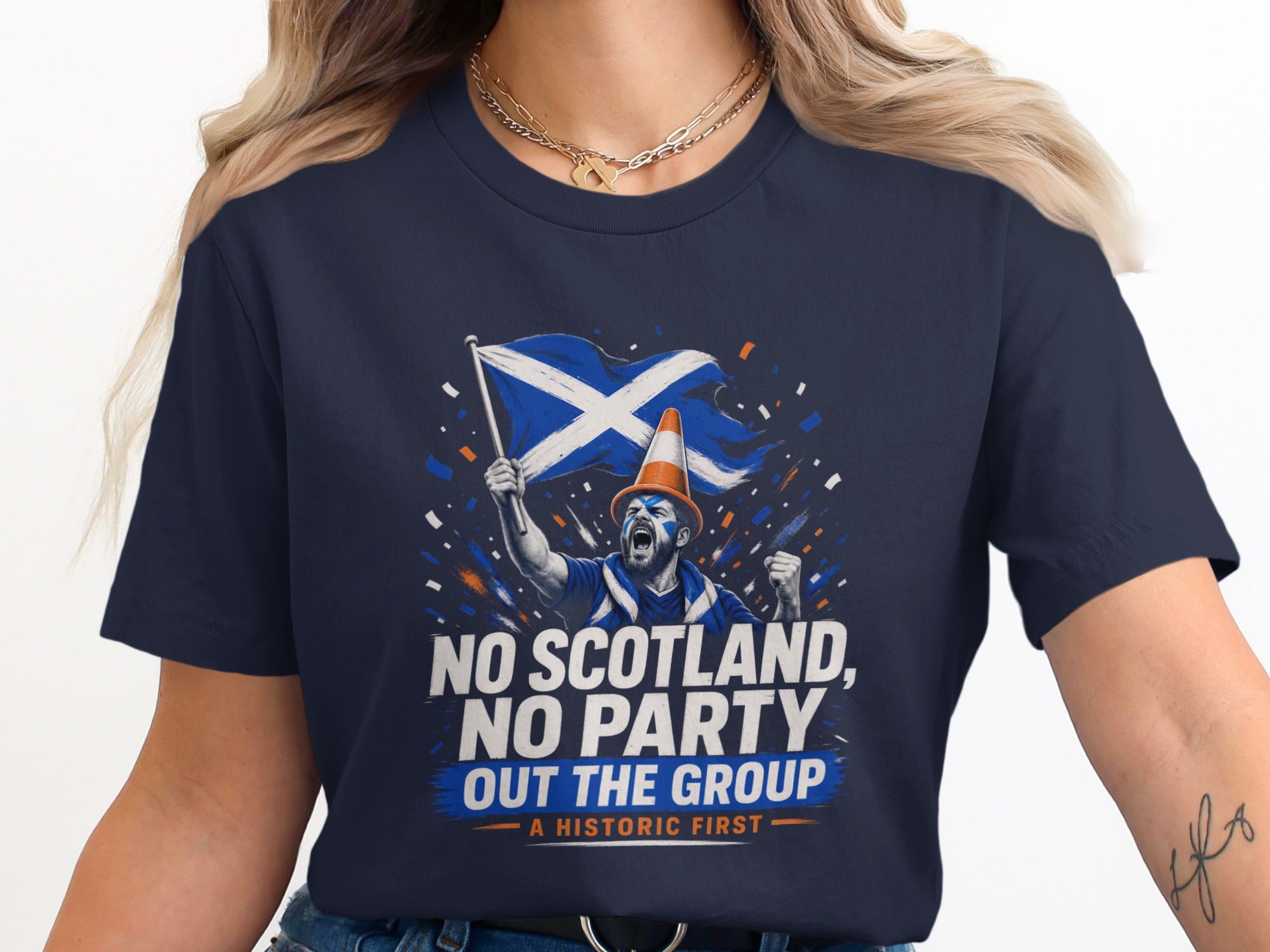 Scottish fan in a navy t-shirt waves Scotland flag, "NO SCOTLAND, NO PARTY" text.