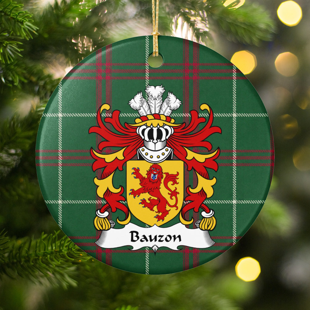 Bauzon ornament hanging in a Christmas tree with warm lights; a red upright lion facing forward on a gold shield on Welsh national tartan.