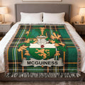 McGUINNESS tartan blanket with coat of arms on a bed.