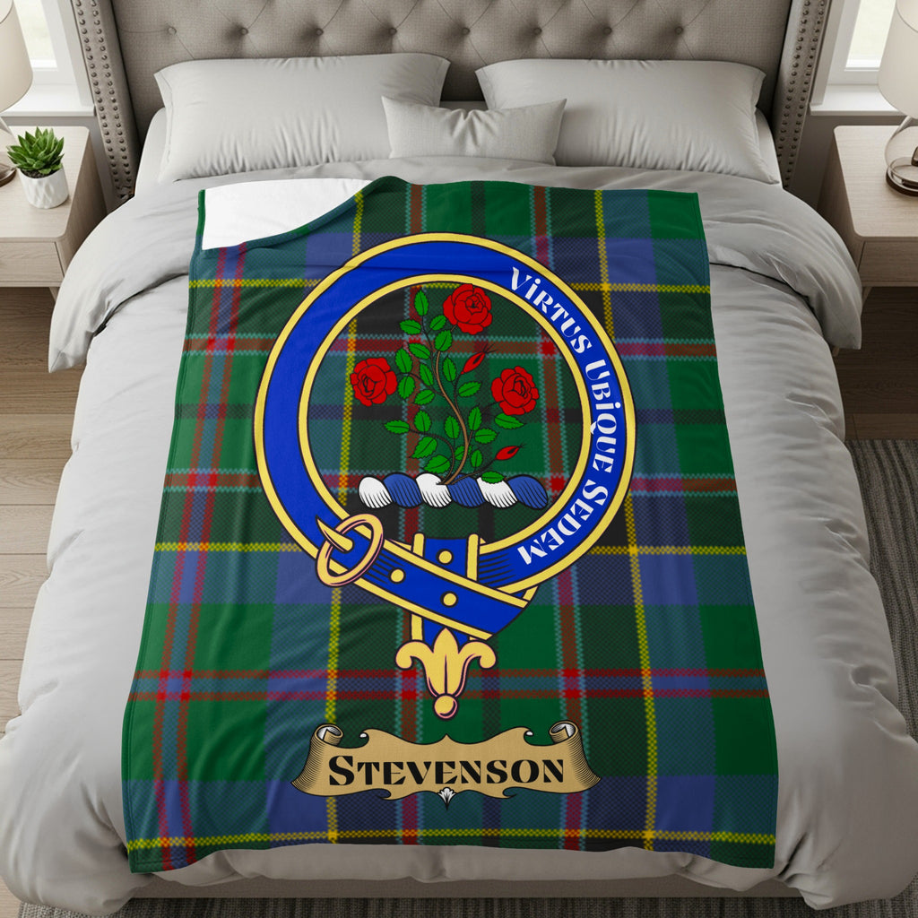 Stevenson clan crest with roses on green and blue tartan throw