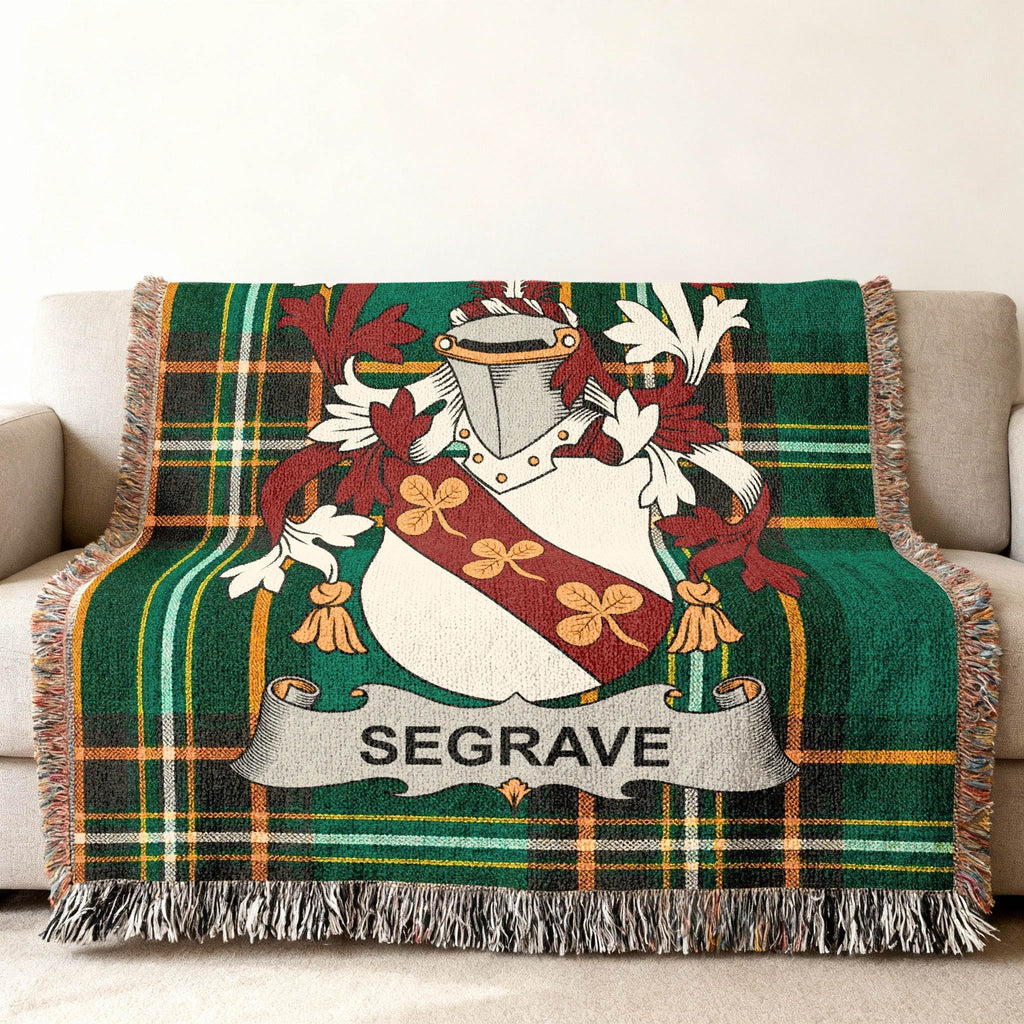 Tartan throw blanket featuring a crest with the name "SEGRAVE".
