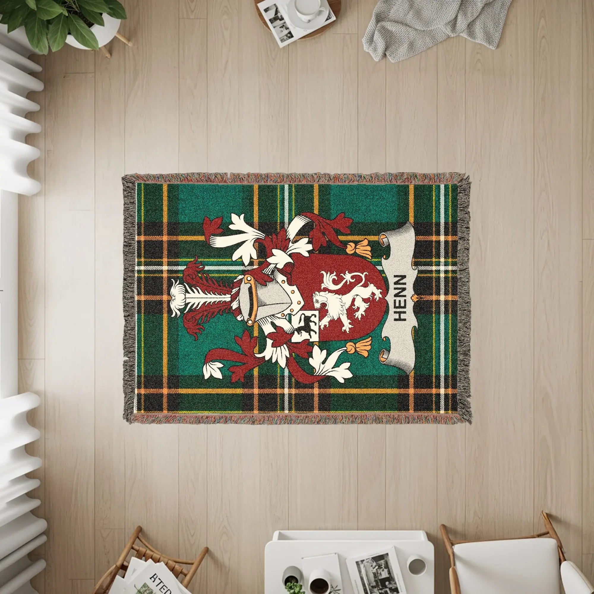 Henn family crest on a green plaid woven throw blanket.