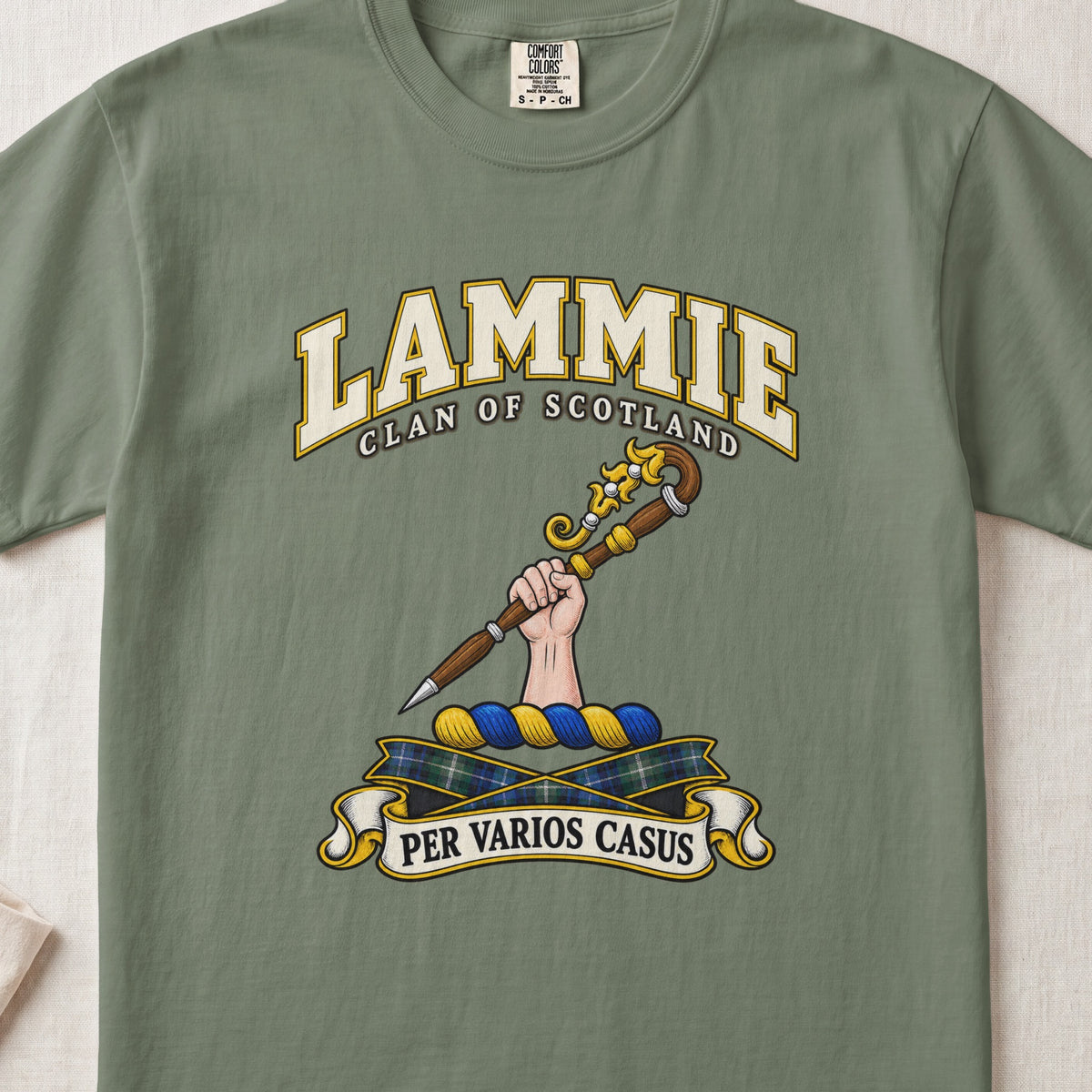 Lammie Scottish clan T-shirt in Moss, front view with a hand holding an ornate crozier and motto design.