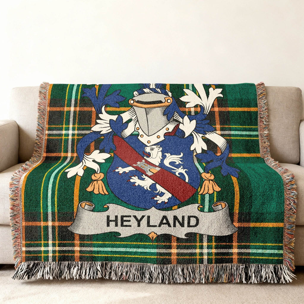 Tartan throw blanket with Heyland family crest in blue, white, and red.