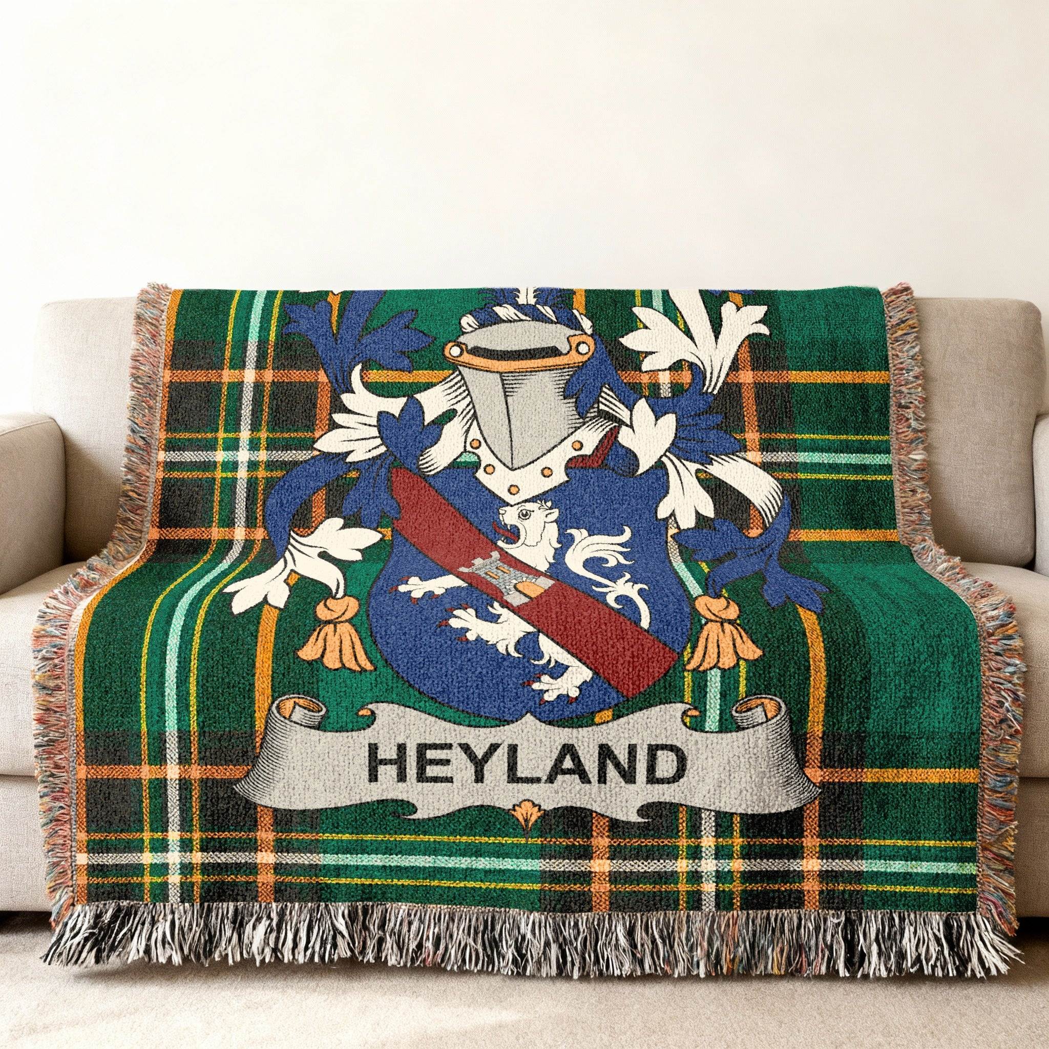 Tartan throw blanket with Heyland family crest in blue, white, and red.