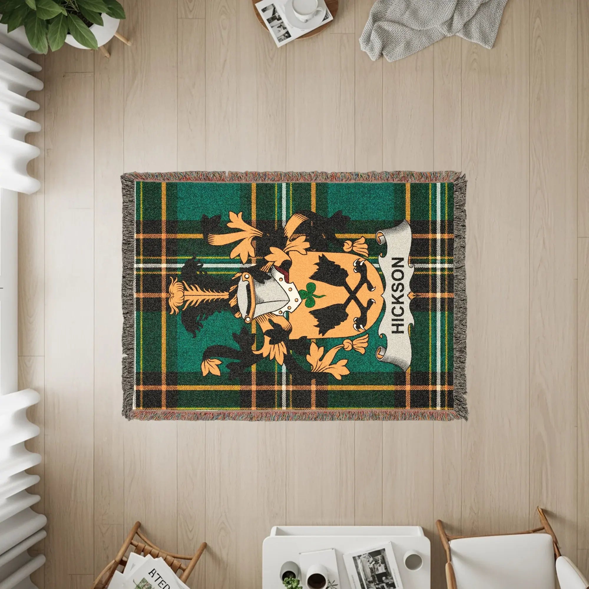 Green plaid blanket with Hickson family crest and gold accents.