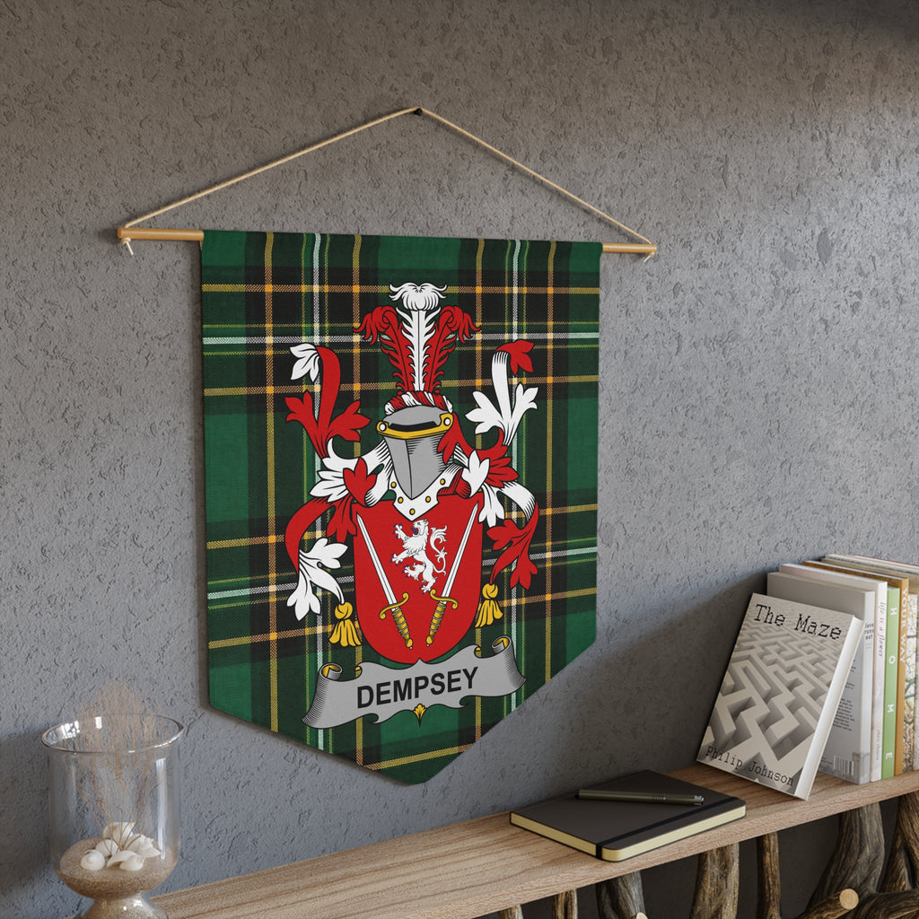 Dempsey family crest pennant with green plaid background hanging on wall.