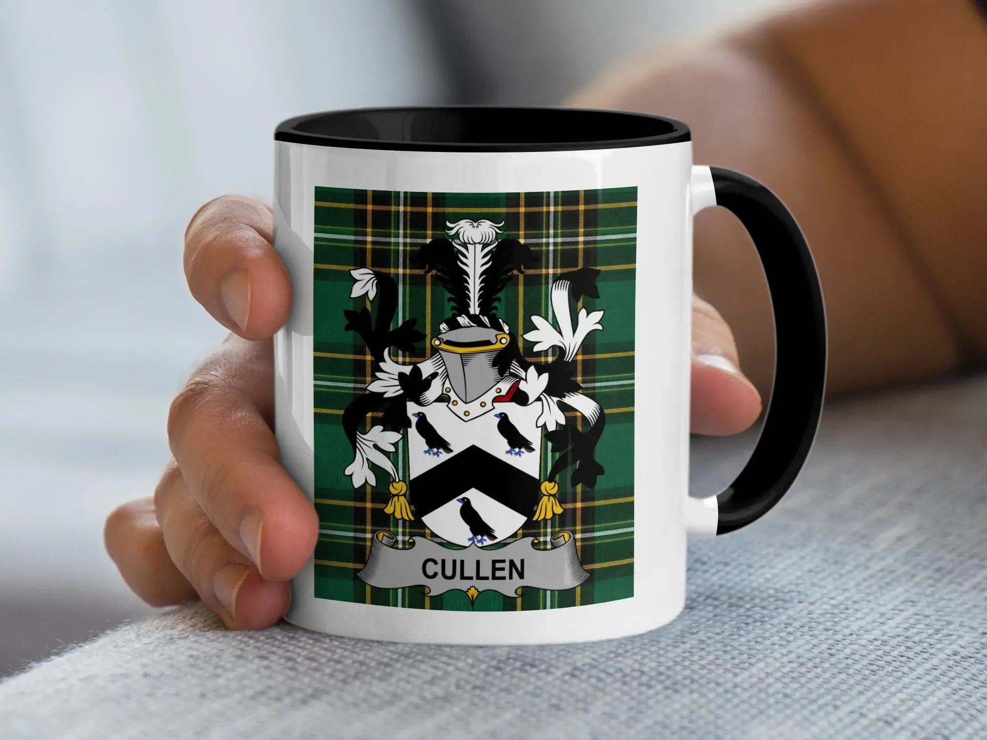 White mug with black handle featuring green plaid and a family crest with "CULLEN" text.