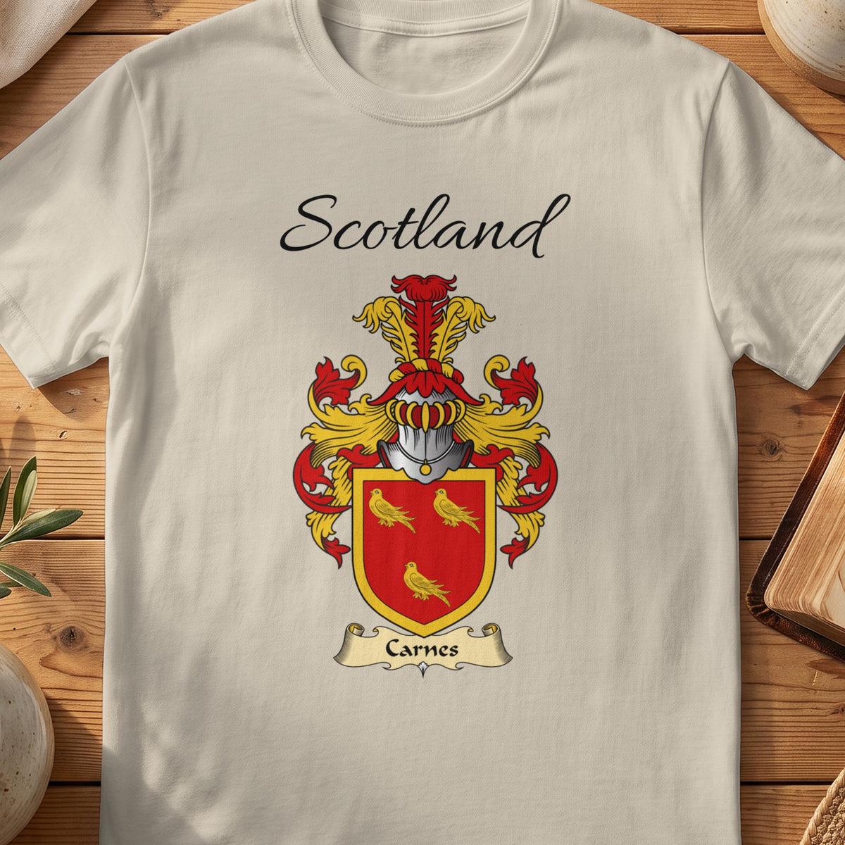 Sand Carnes Scottish family shield T-shirt featuring three gold birds on a red shield