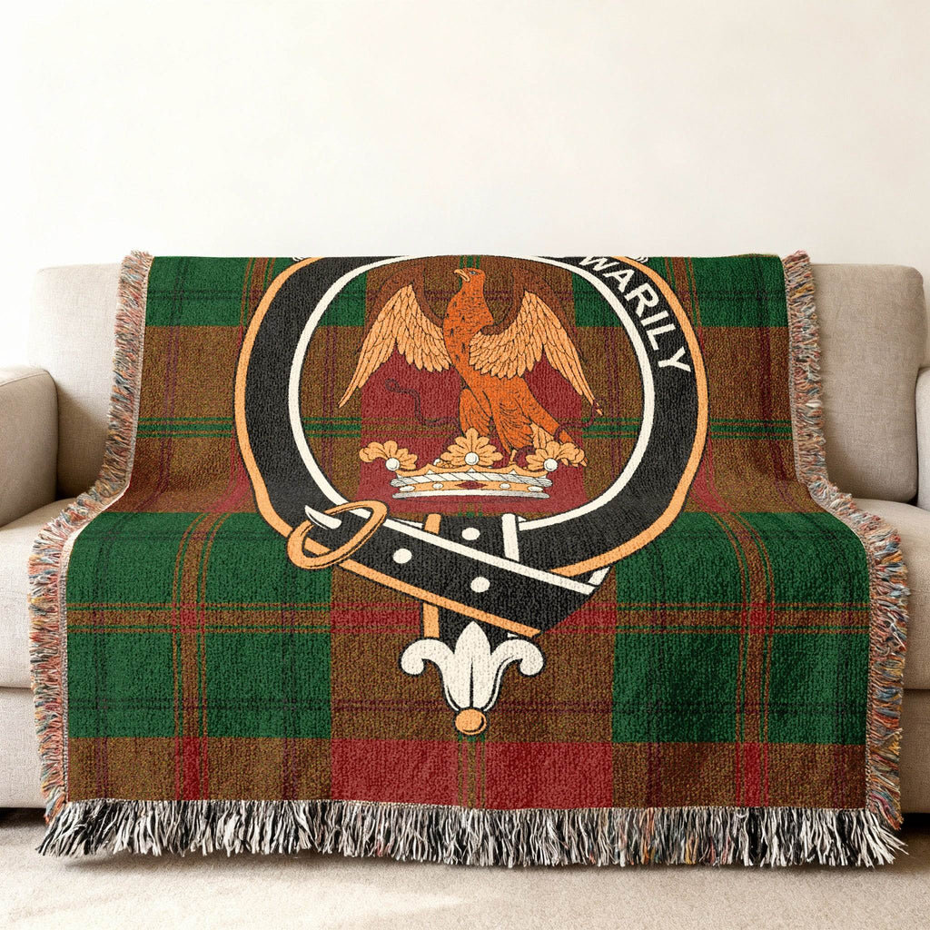 Drummond clan crest tartan woven blanket draped — personalised coat of arms, fringe edges
