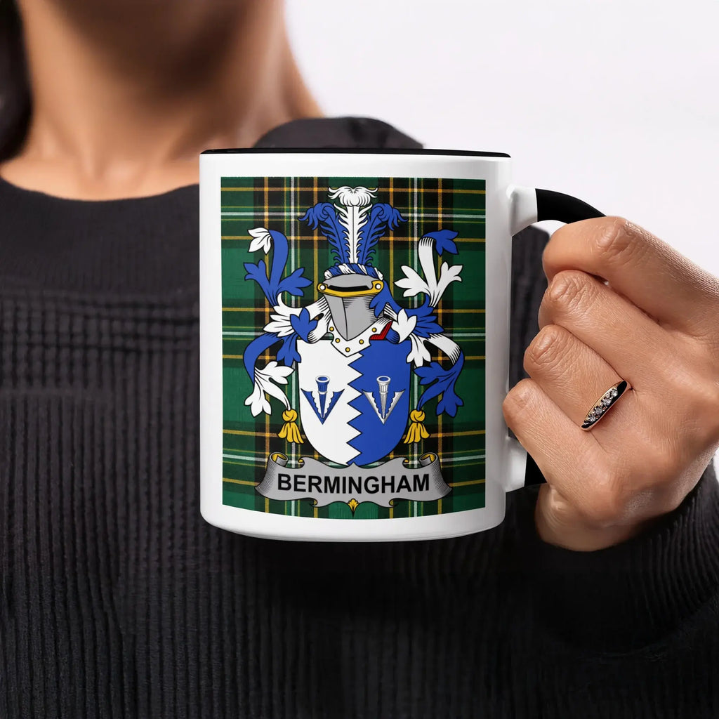 Mug with Birmingham crest on green tartan background.