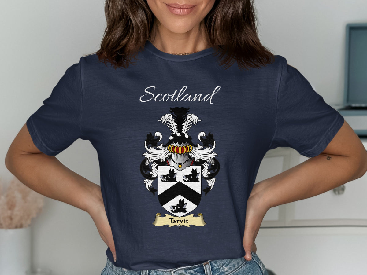 Model wearing the navy Tarvit family crest T-shirt featuring “Scotland” and the surname banner.
