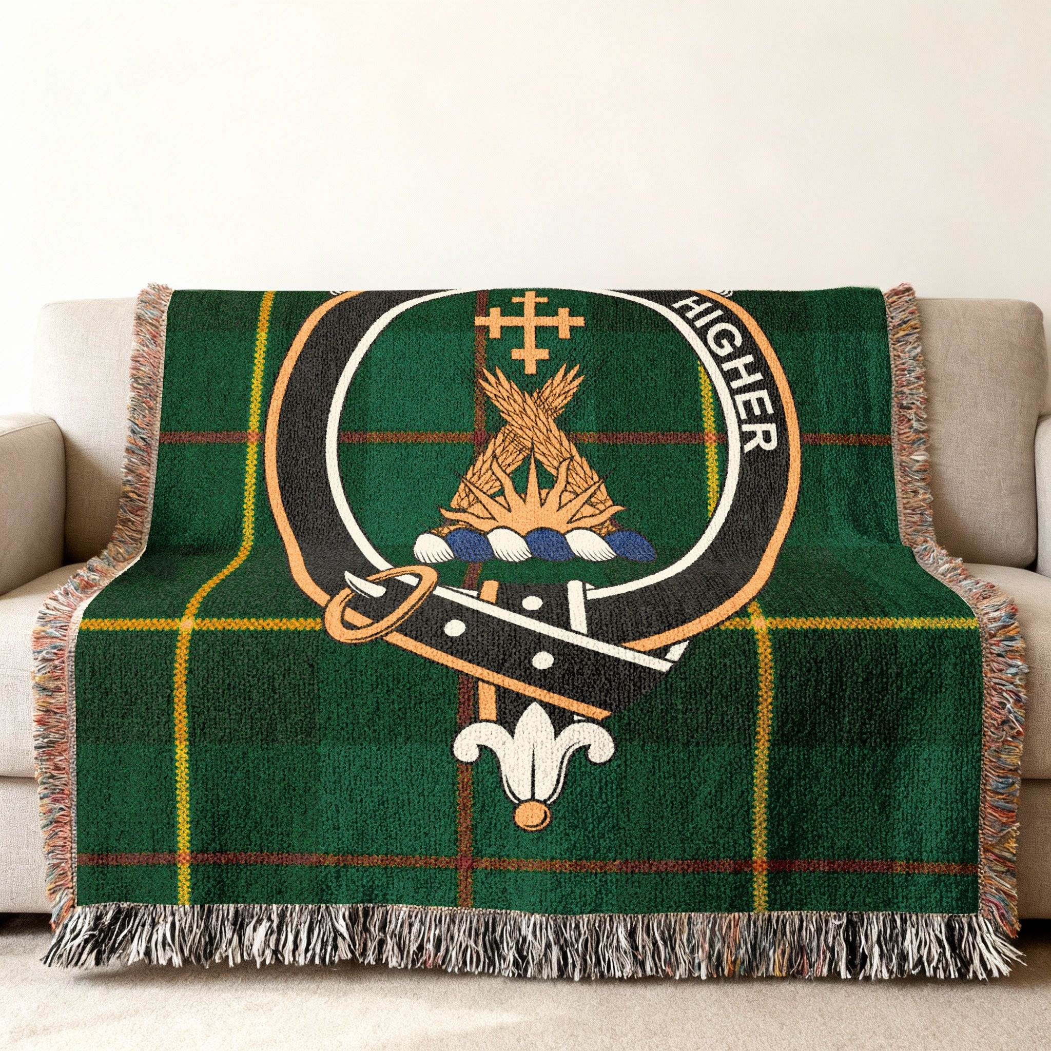 Galloway tartan woven blanket — close-up of clan crest and tartan weave pattern in green tones