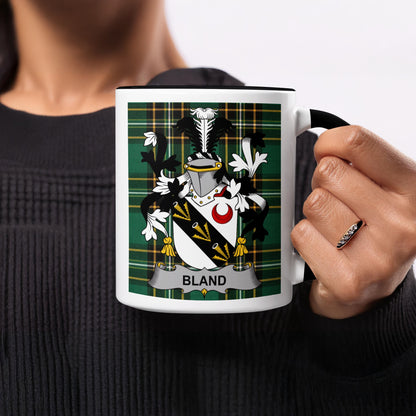 Mug with a black handle featuring the Bland family crest on a green plaid background.