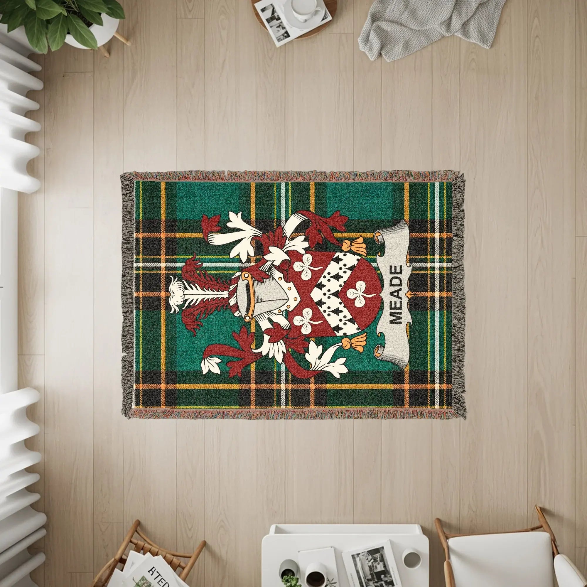 Tapestry with green plaid background featuring a coat of arms and "MEADE" text.