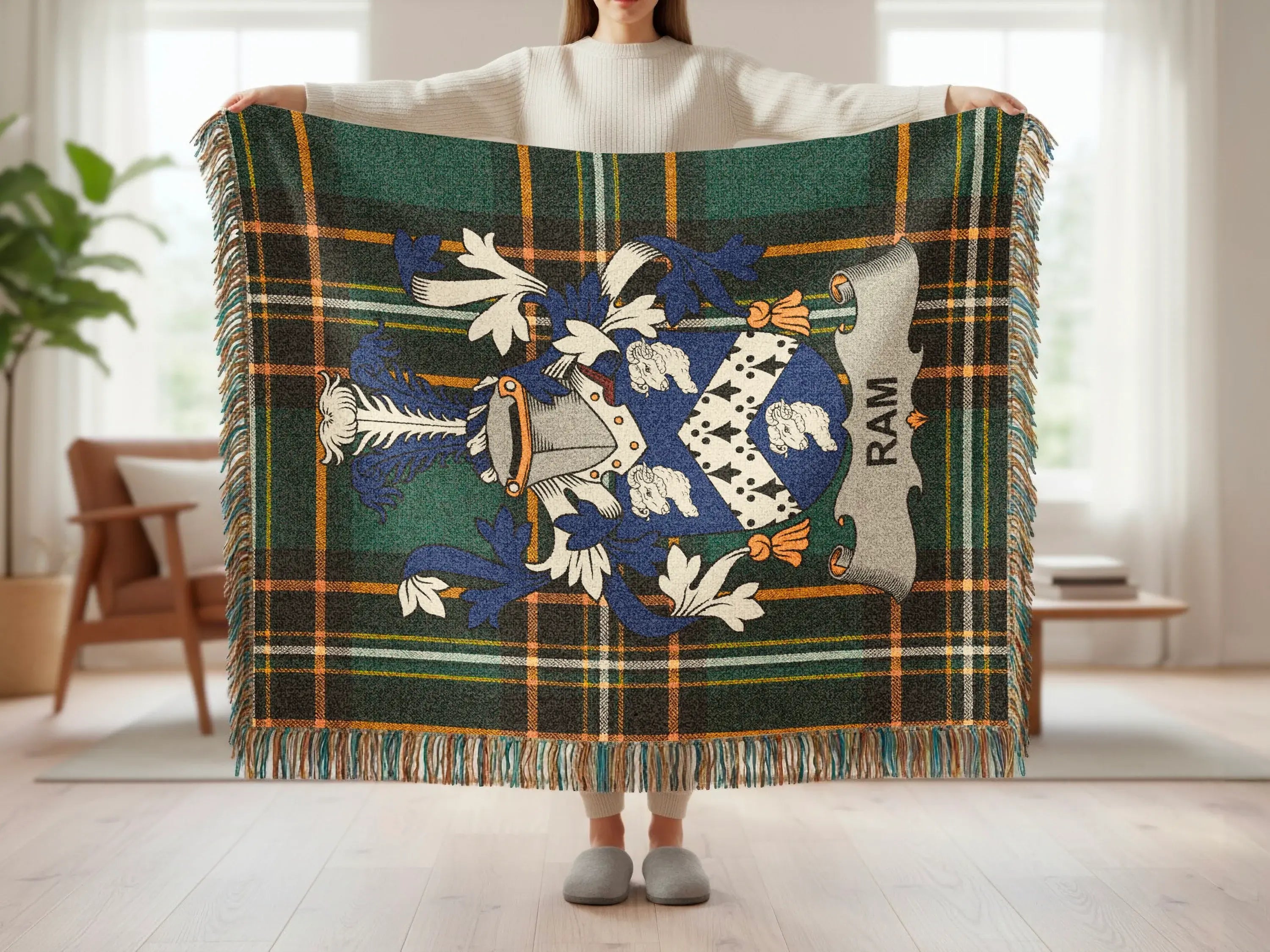 Tartan blanket with blue and white crest, "RAM" banner, and fringe.