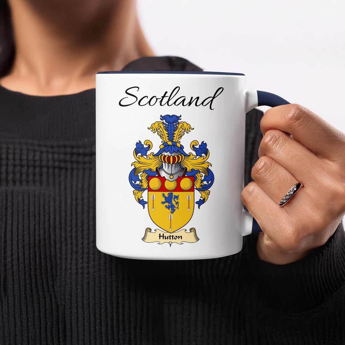 Hutton 11 oz Scottish family crest ceramic mug showing a Scotland-topped heraldic emblem