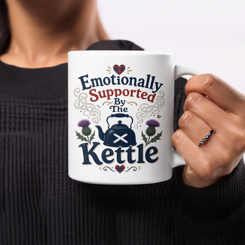Mug with "Emotionally Supported By The Kettle" text and Scottish thistle design.