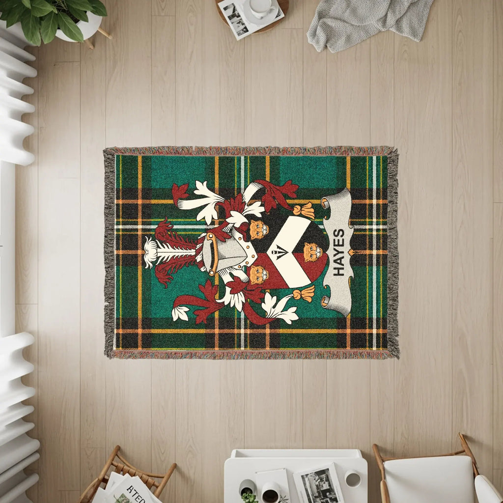 Hayes family crest on a tartan throw rug, viewed from above.