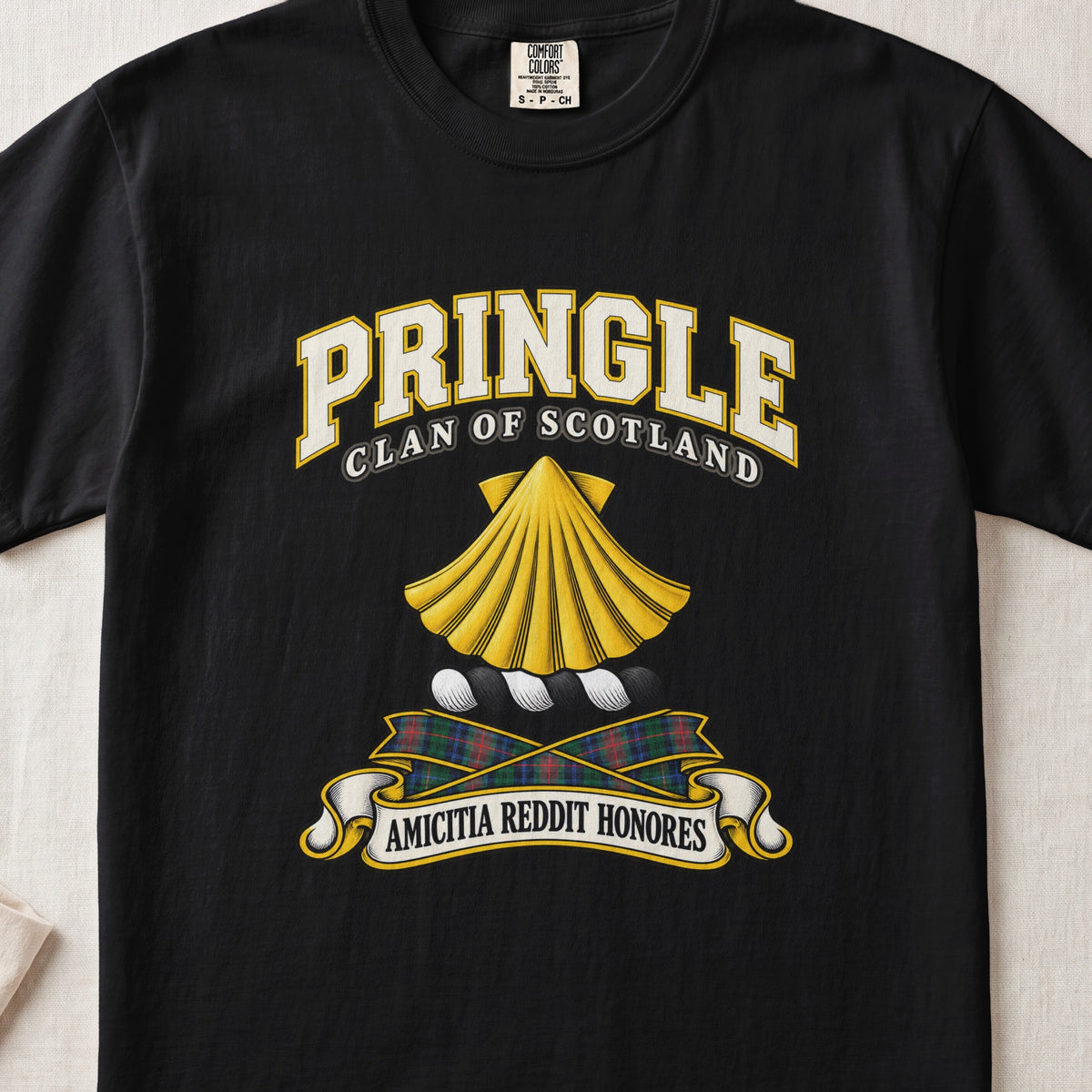Pringle Scottish clan T-shirt in Black, front view with a golden scallop shell and motto design.
