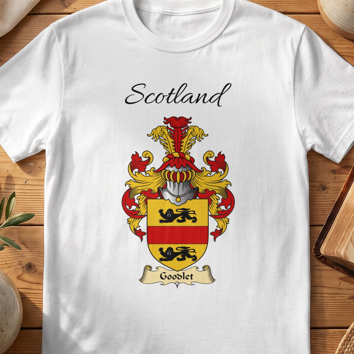 White Goodlet Scottish family shield T-shirt featuring a black lions separated by a red band on gold