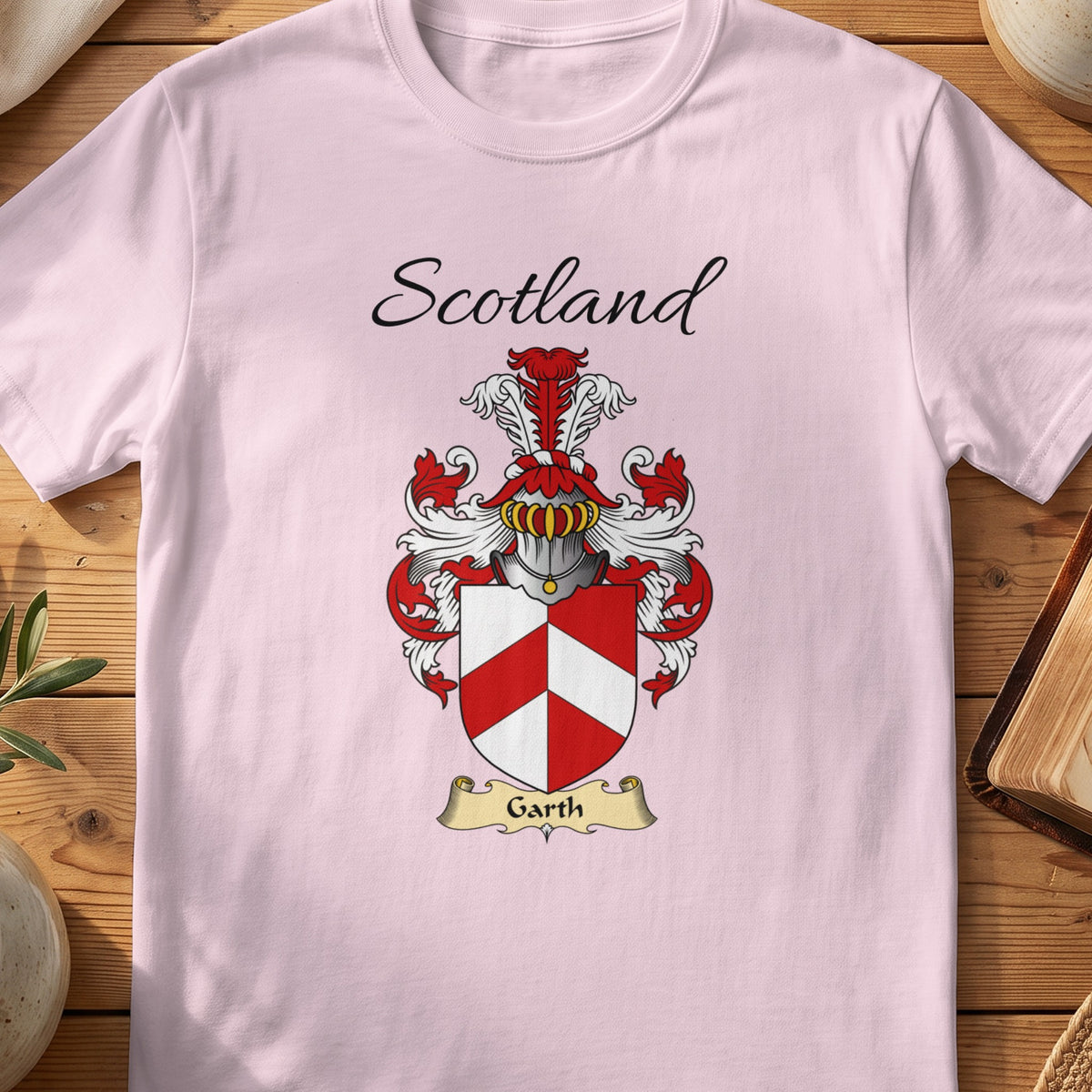 Light Pink Garth Scottish family shield T-shirt featuring a red-and-white geometric chevron design