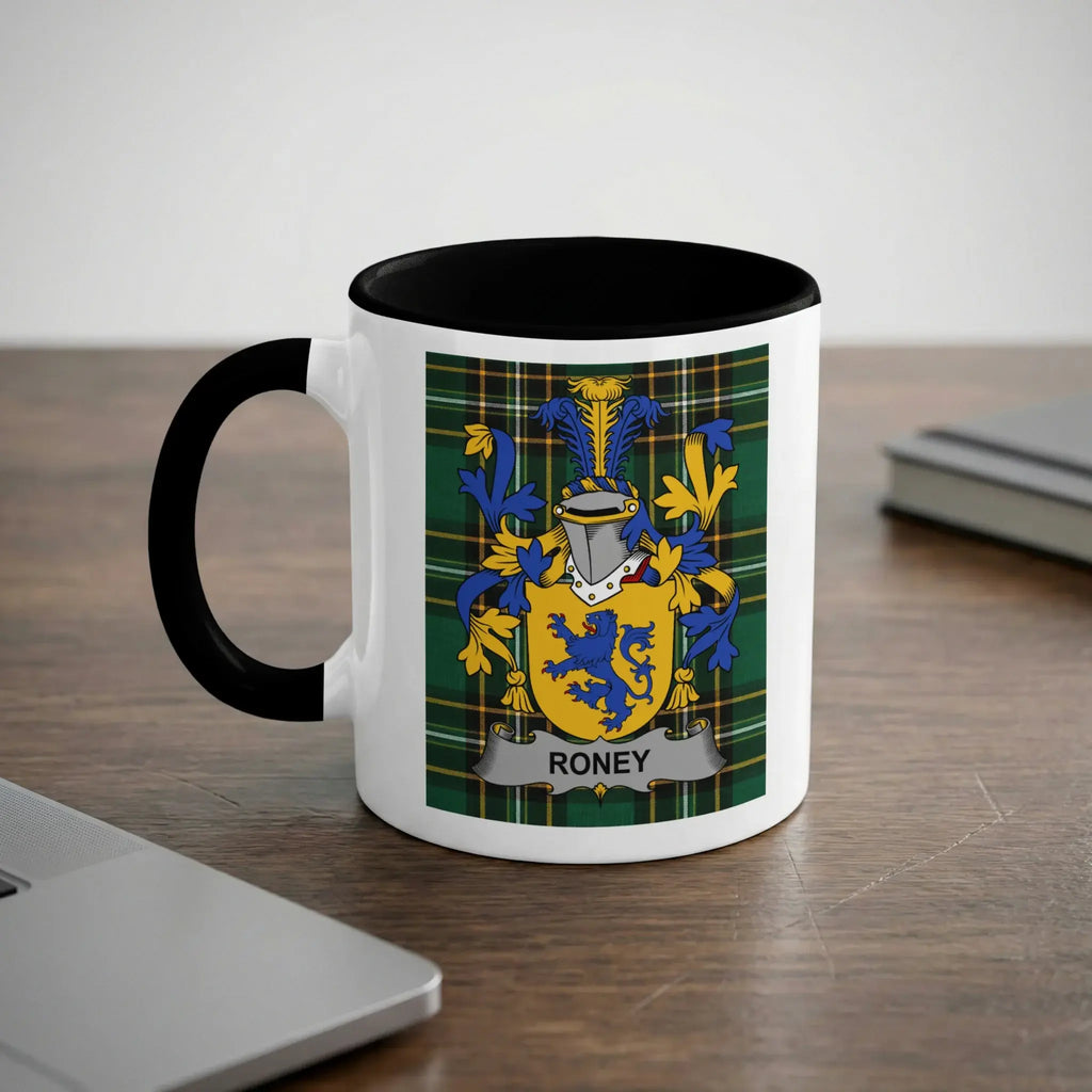 White mug with black handle featuring the Roney family crest on a plaid background.