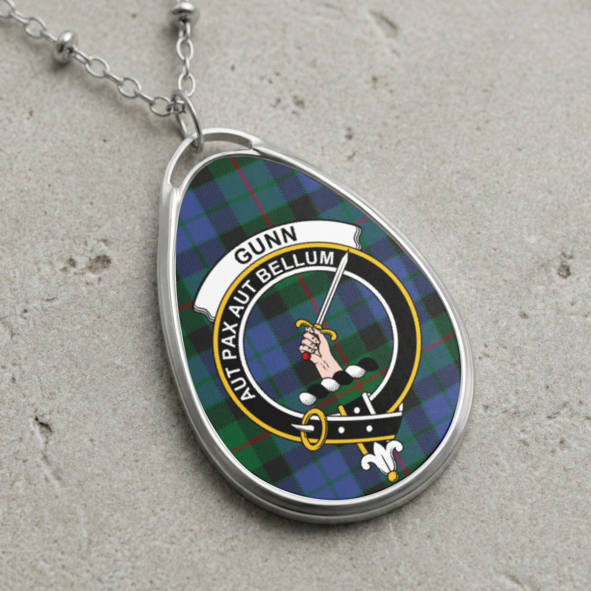 Gunn clan Scottish tartan necklace with clan crest and Aut Pax Aut Bellum motto on tartan background