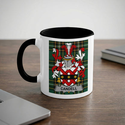 White mug with black rim featuring the Candell family crest on a tartan background.