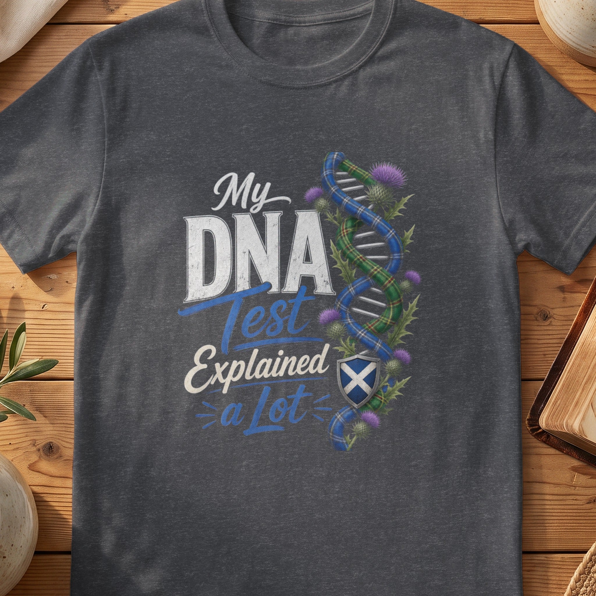 Dark grey Gildan 64000 unisex T-shirt flatlay with My DNA Test Explained a Lot Scottish graphic design