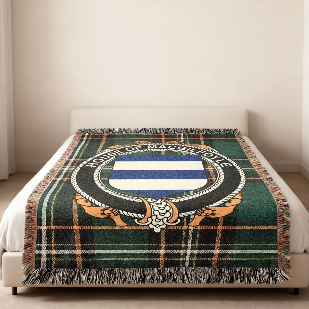 MacGilfoyle family crest emblem woven blanket displayed on a bed