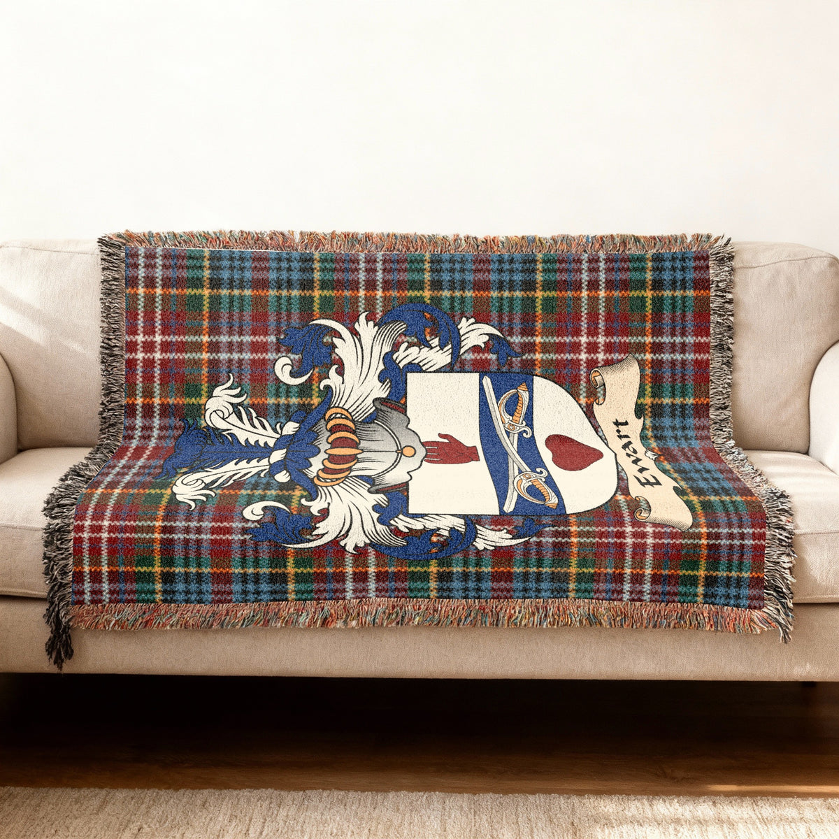 Ewart Scottish woven blanket with family shield and Caledonia tartan background