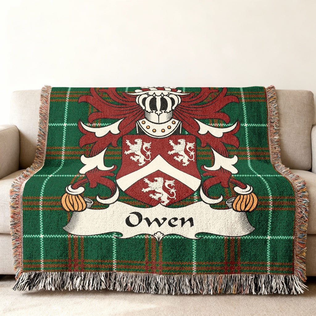 Green tartan throw blanket with the Owen family crest.