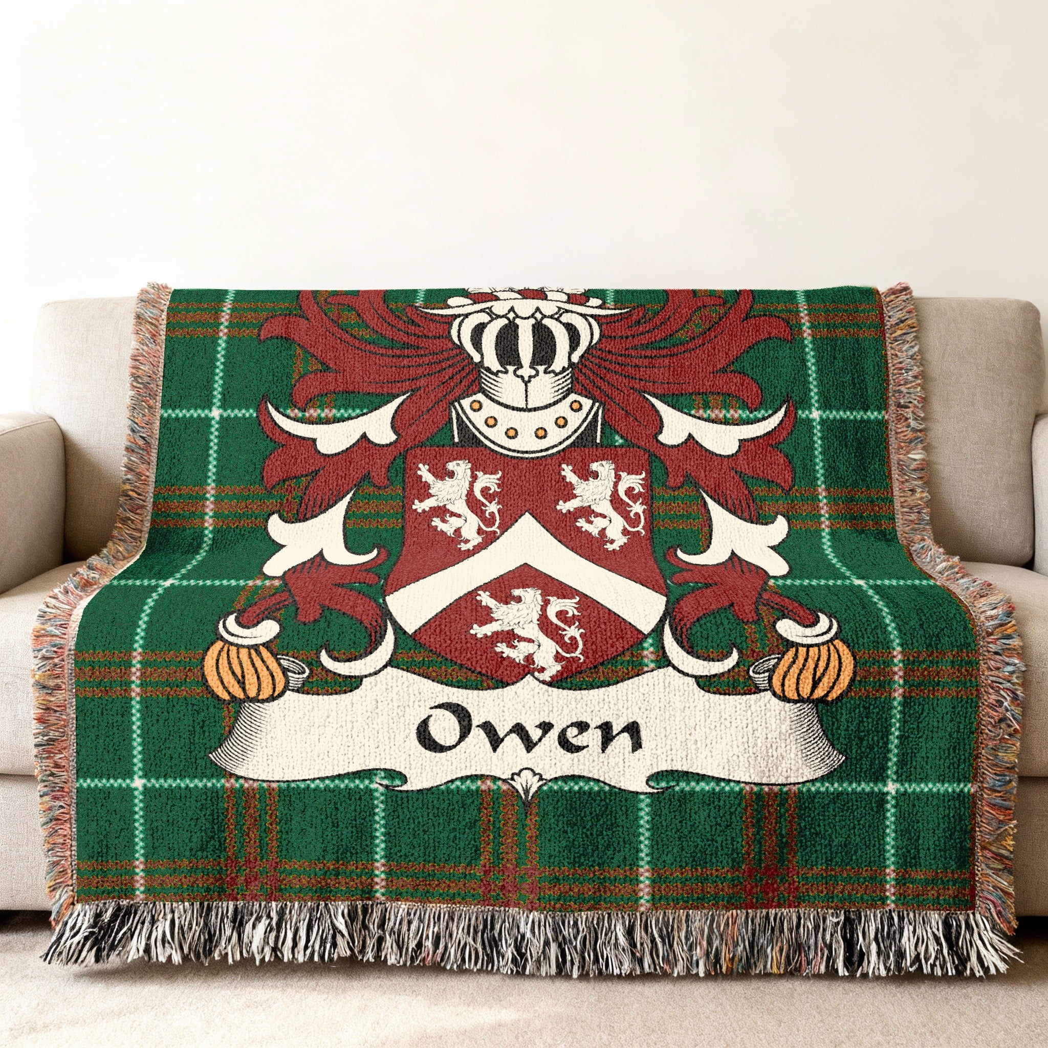 Green tartan throw blanket with the Owen family crest.