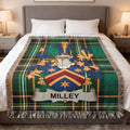 Milleys coat of arms displayed on a green plaid throw blanket.